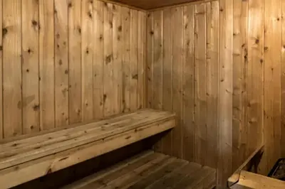 a wooden sauna with a wooden bench in it at The Summit 5 in Mammoth Lakes