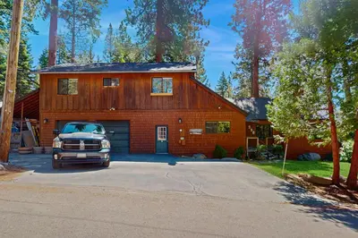 a truck parked in front of a house at Casual and Cute Cabin Near the Lake in Tahoe Vista
