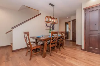 a dining room with a wooden table and chairs at Mountainside 4 in Mammoth Lakes