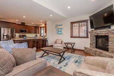 a living room with a couch and a fireplace at Mountainside 4 in Mammoth Lakes
