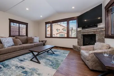 a living room with a couch and a fireplace at Mountainside 5 in Mammoth Lakes