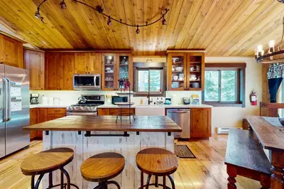 a kitchen with wooden cabinets and a wooden ceiling at Tastefully-Updated, Classic Tahoe Family Home in Truckee