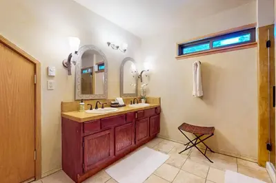 a bathroom with two sinks and a mirror at Tastefully-Updated, Classic Tahoe Family Home in Truckee