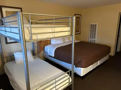 two bunk beds in a room with two beds at Big Pines Mountain House in South Lake Tahoe