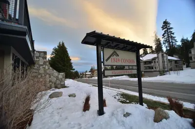 a sign in the snow next to a street at 1849 #308 in Mammoth Lakes