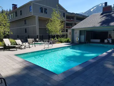 a swimming pool in front of a building at 1849 #308 in Mammoth Lakes