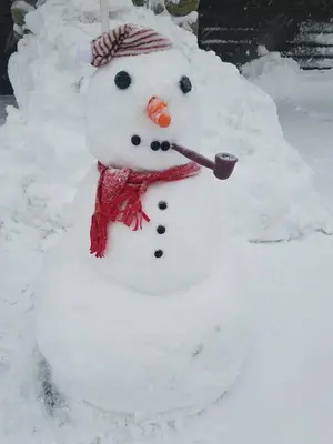 a snowman with a spoon in its mouth at 1849 #308 in Mammoth Lakes