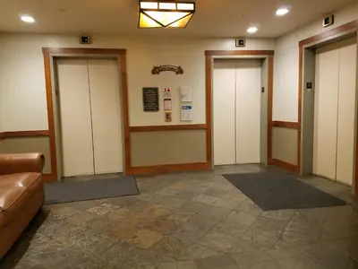 a waiting room with three elevators in a building at Juniper Springs Lodge #543 in Mammoth Lakes