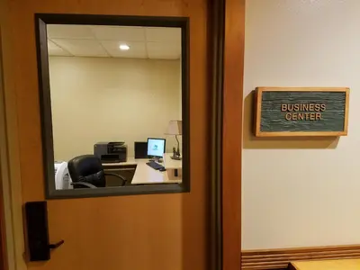 an office door with a sign that reads business center at Juniper Springs Lodge #543 in Mammoth Lakes