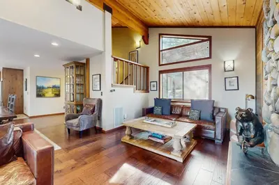 a living room with a couch and a table at Sophisticated Northstar Mountain Retreat in Truckee