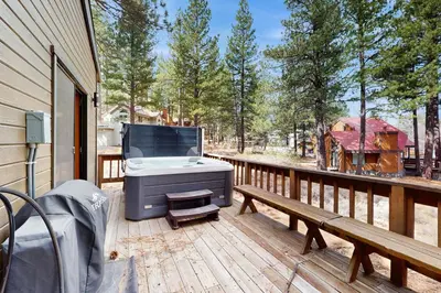 a grill sitting on the deck of a house at Sophisticated Northstar Mountain Retreat in Truckee
