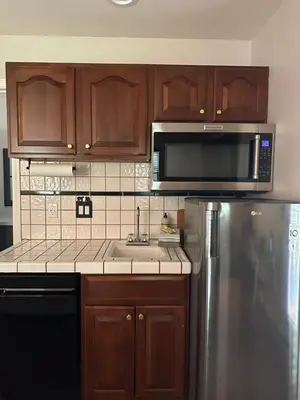 a kitchen with a sink and a microwave at YoBee! Park Reservation Included! Heart of Yosemite - Homey Studios and Breakfast in Yosemite West