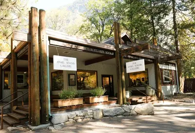 a building with signs on the front of it at Curry Village in Curry Village
