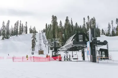 a ski slope with a ski lift in the snow at Oak Retreat by Yosemite National Park in Coarsegold