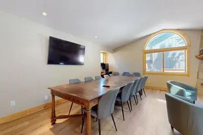 a conference room with a wooden table and chairs at Sweet Cherry Hills Escape in South Lake Tahoe