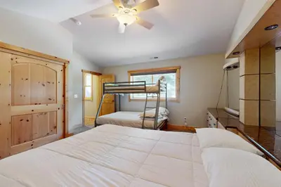a bedroom with a bed and a bunk bed at Sweet Cherry Hills Escape in South Lake Tahoe