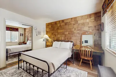 a bedroom with a bed and a desk at Tallac Views Getaway in South Lake Tahoe