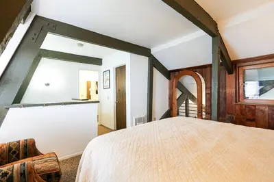 a bedroom with a large bed and a window at Bigwood #80 condo in Mammoth Lakes