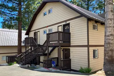 a large house with stairs on the side of it at Mammoth View Villas 35 in Mammoth Lakes