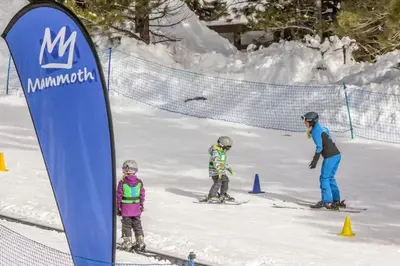 a group of people on skis in the snow at Mammoth View Villas 35 in Mammoth Lakes