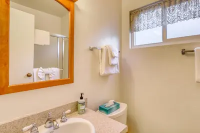 a bathroom with a sink and a mirror and a toilet at Mammoth View Villas 35 in Mammoth Lakes