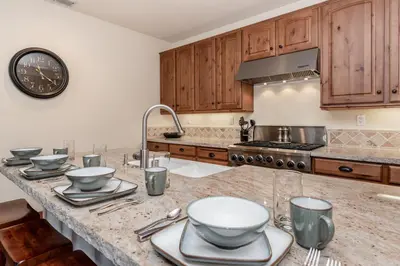 a kitchen with a counter with bowls and utensils on it at Creekhouse 1312 in Mammoth Lakes