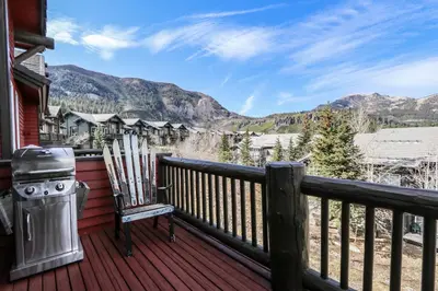 a deck with a stove and a grill on it at Snowcreek V #999 condo in Mammoth Lakes