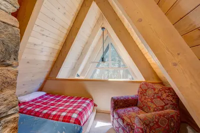 a room with a chair and a window at Relaxation on Muletail in Carnelian Bay