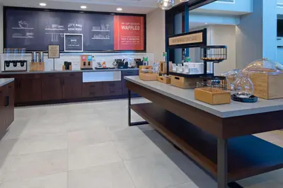 a store with a counter with products on it at Hampton Inn & Suites Gilroy, Ca in Gilroy