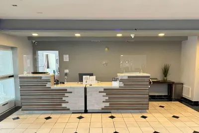 a lobby with a reception desk in a building at La Quinta by Wyndham Tulare in Tulare