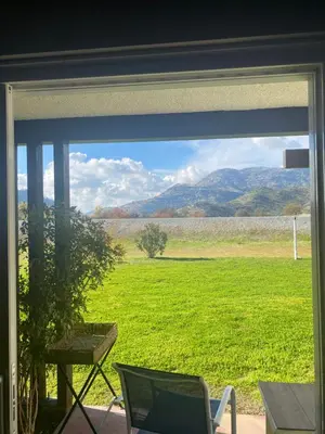 a view of a field from a window at Western Holiday Lodge in Three Rivers