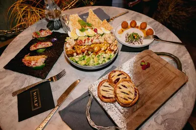 a table with a bunch of food on it at Caesars Republic Lake Tahoe, A Caesars Destination in Stateline