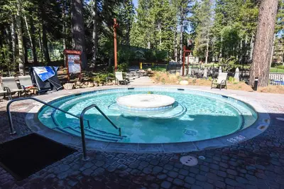 a small pool with a fountain in the middle at Studio Apartment in Truckee