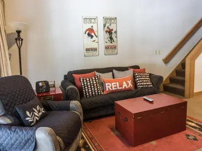 a living room with a couch and a table at Studio Apartment in Truckee