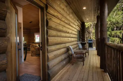 a wooden wall on a porch of a house at 38 The Mini Cabin in Wawona