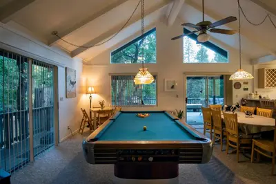 a pool table in the middle of a room at 43 The Last Resort in Wawona