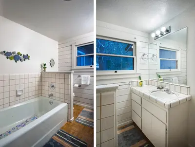 a bathroom with a tub and a sink at 43 The Last Resort in Wawona