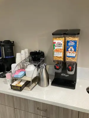 a kitchen counter with some food items on it at Days Inn Merced / Yosemite Area in Merced