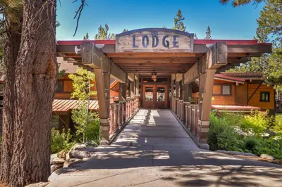 a building with a sign that reads lodge at Trout Creek Condo in Truckee