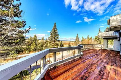 a house with a deck with a view at Sleek Hill Haven with Martis Valley Views in Polaris