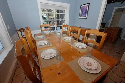 a wooden table with chairs and a dining room at 3664 Birch Avenue cabin in South Lake Tahoe