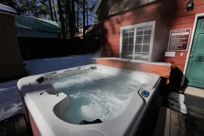 a jacuzzi tub sitting outside of a house at 3664 Birch Avenue cabin in South Lake Tahoe