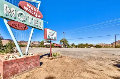 a sign for a motel on the side of a road at The Historic West Walker Motel in Walker