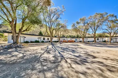 a building with trees in front of it at The Historic West Walker Motel in Walker