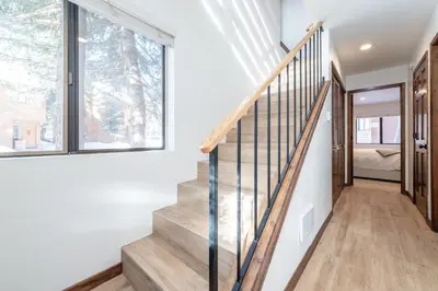 a staircase in a house with a window at Snowflower 12 in Mammoth Lakes