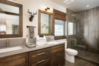 a bathroom with a sink and a toilet and a shower at West Shore - West Shore Hideaway in Tahoma