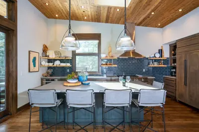 a kitchen with a large table and chairs at West Shore - West Shore Hideaway in Tahoma