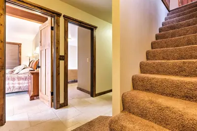 a stairway leading to a room with a bedroom at Cozy Lake-View Hideaway! Pet-Friendly Truckee Home in Truckee