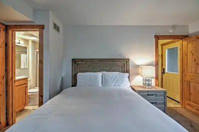 a bedroom with a large bed and a bathroom at Northstar Resort Shuttle Access Truckee Condo in Truckee