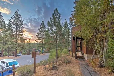 a building with a car parked next to a street at Northstar Resort Shuttle Access Truckee Condo in Truckee